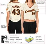Custom Womens V-Neck Cropped Baseball Jersey in Cream Black Orange and Old Gold Custom Women's Cream Black Orange-Old Gold