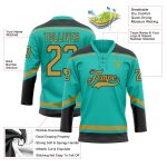 Custom aqua, old gold and black lace-neck hockey jersey, detail of the printed panel