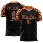 Custom black and orange soccer jersey