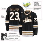 Custom black, white and old gold hockey jersey, back view