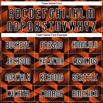 Custom orange, black and white volleyball jersey, flat lay