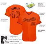 Custom orange and black baseball jersey, detail of the printed panel